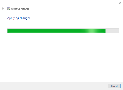 Screenshot of the 'Turn Windows features on or off' window, with a progress bar saying 'Applying changes'