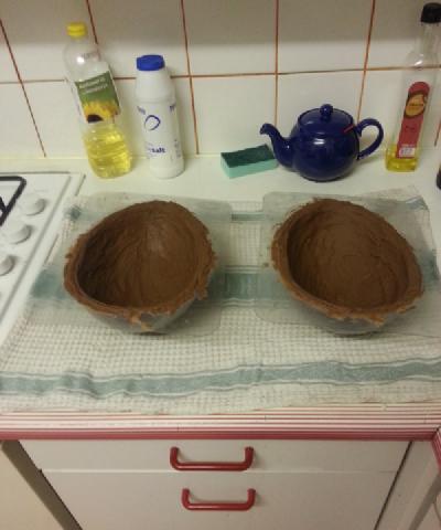 Photo of two giant egg moulds coated in a thick layer of solid chocolate