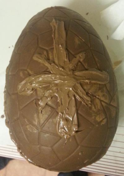 Photo of giant creme egg with creme egg logo amateurly painted on the front