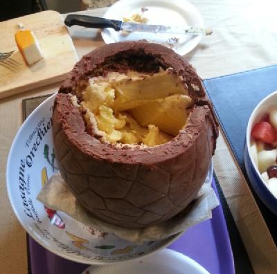 Photo of giant creme egg with top broken open