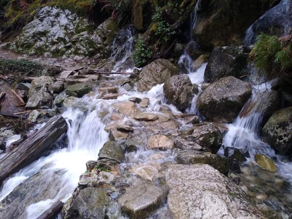 A trail of large stones with water pouring over.