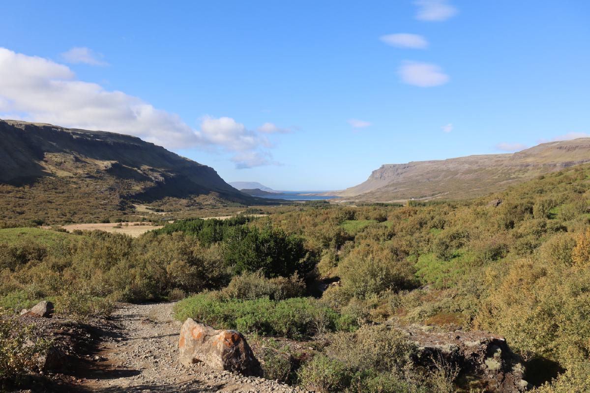 Photo of u-shaped valley in distance.