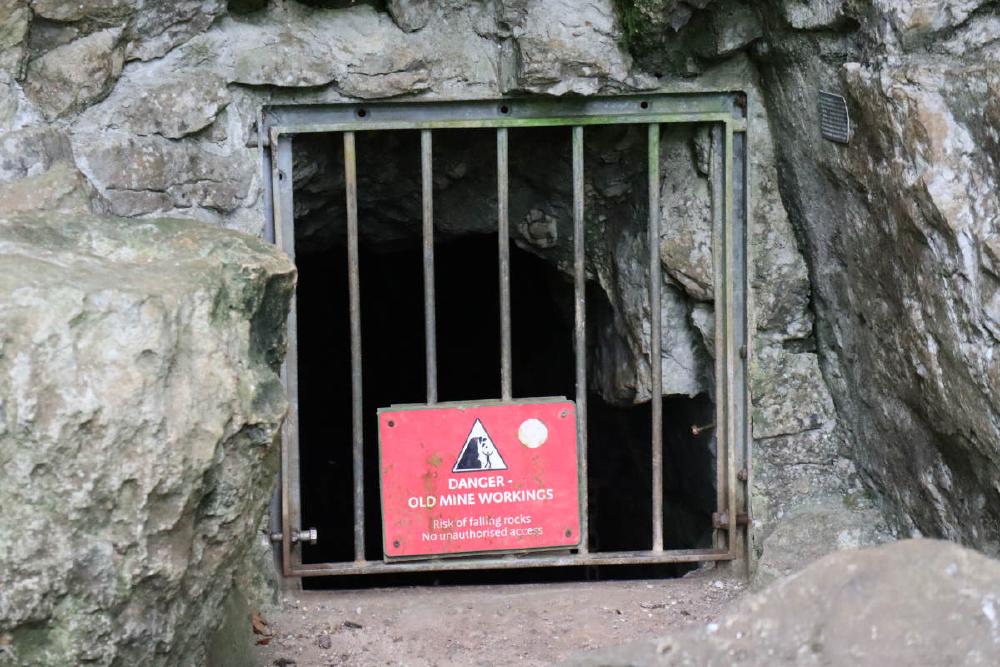 A close up of the cage. A sign says: DANGER - OLD MINE WORKINGS.