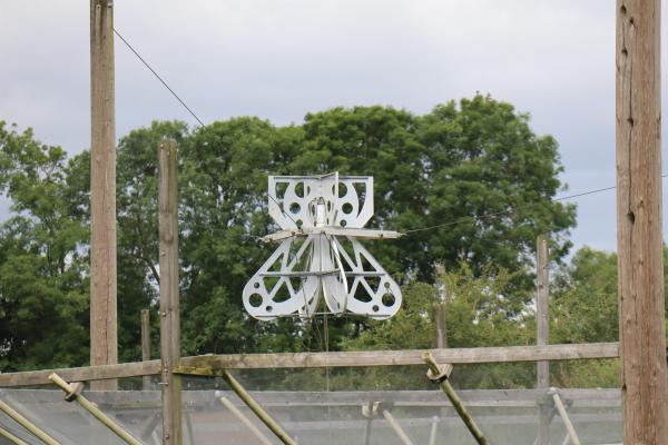 A receiver, a horn antenna with many holes cut in it to reduce its weight.
