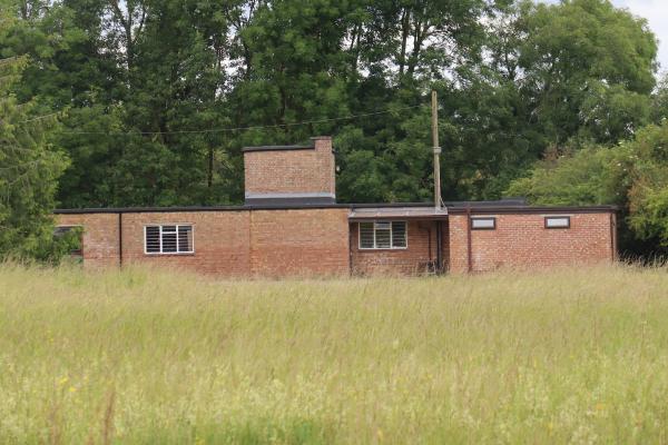 A one storey red brick building.