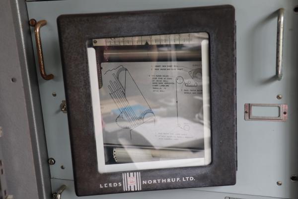 A clear panel viewing inside some rack mounted equipment.