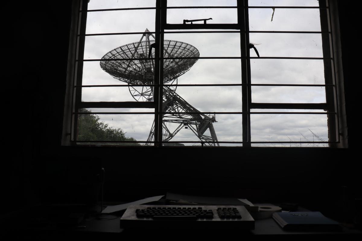 A view from the desk, looking out through a window down the track towards the One-Mile and Half-Mile Telescopes.