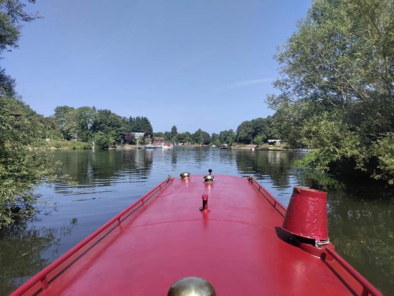 Looking over the red boat towards the river Thames.