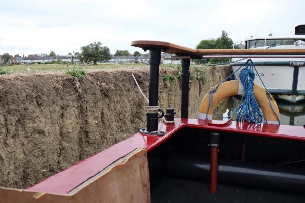 The vertical dirt bank.