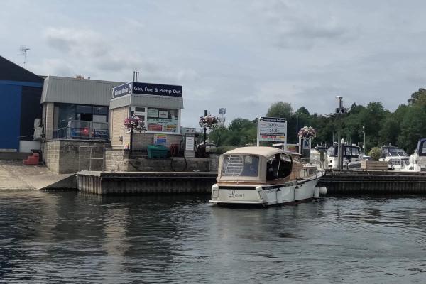 A diesel pump on the side of the river by the marina entrance.