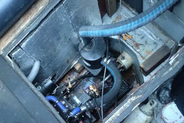 Looking down at the engine, having lifted up the floor boards.