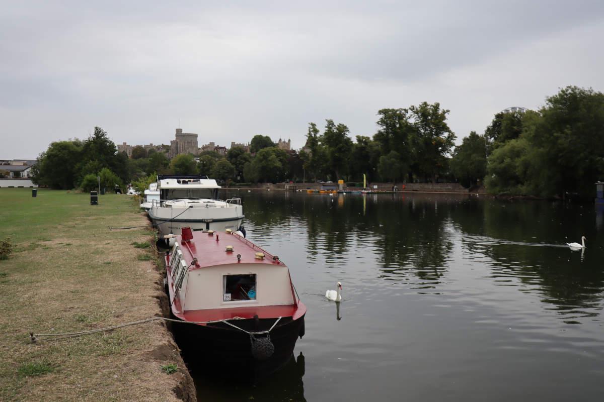 Our little red boat with Windsor Castle in the background.