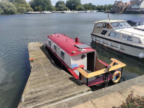 The boat moored up at the marina.