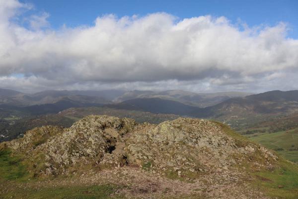 A patch of rocks at the edge of the hill.