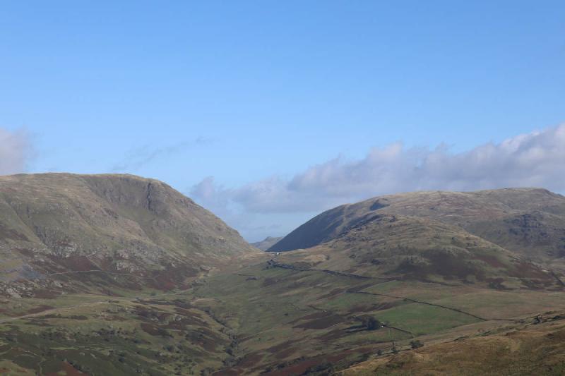 A distant building at the top of the pass.