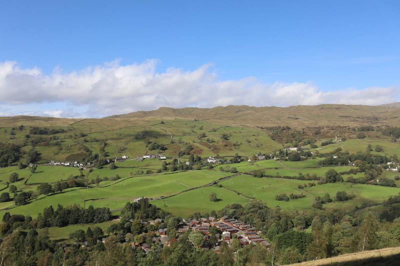 A valley with a village and holiday park.