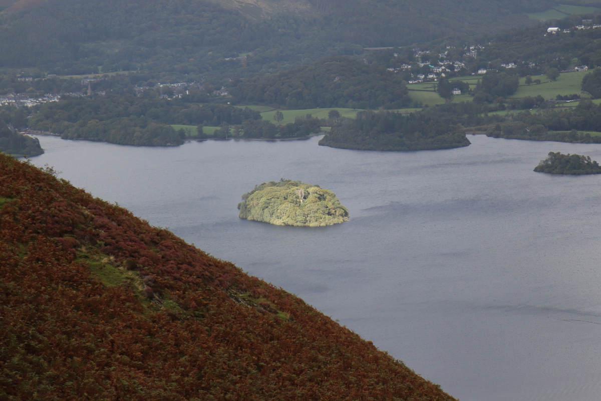 A bright distant island surrounded by darkness.