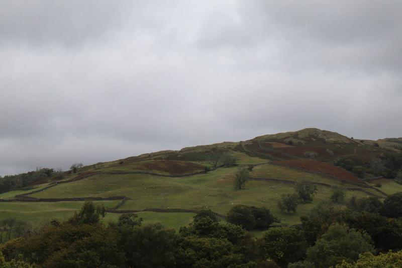 Distant hills and walls.