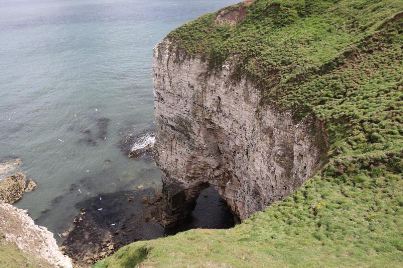 Looking down from the cliffs into a cove.